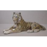 Royal Copenhagen tiger figure tiger resting. Marked 714 to underside. H13cms L30cms approx.