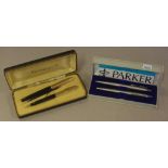 Waterman"s rolled gold cased pen set with 14KT nib on one and both pens inscribed, together with a