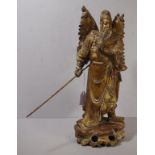 Chinese carved wood gilded sage figure sage holding a ceremonial lance. H33cms approx.