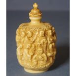 Chinese carved ivory snuff bottle with carved stopper, cylindrical in shape, with 17 figures in