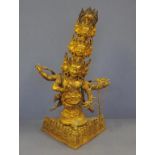 Tibetan gilt metal 11 headed avalokiteswara set with semi-precious stones, 49cm high