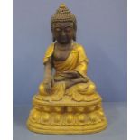 Large Tibetan gilt metal seated Buddha 47.5cm high, corrosion.