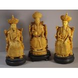 Three Chinese ancestor composition figures on carved timber stand, H34cm approx