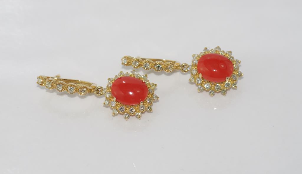 14ct yellow gold, coral and diamond earrings Two orangey-red coral cabochons=4ct, surrounded by 58