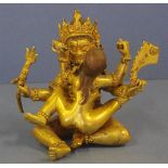 Tibetan gilt metal Yama figure seated in Yab- Yum with his consort Samantabhadri, H12.5cm approx