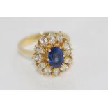 18ct yellow gold ring with blue gem