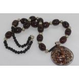 Necklace with brown beads & shell pendant