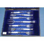 Antique boxed silver plated bread fork set