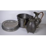 Twelve pewter plates, an ice bucket, ewer