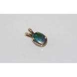 Gold pendant set with opal