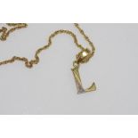 Fine yellow gold chain with "L" pendant
