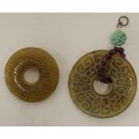 Two various Chinese carved hardstone disc pendants
