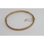 9ct yellow gold twist hinged bracelet