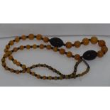String of graduated amber style beads