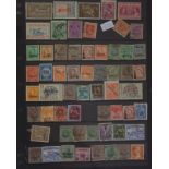 Folder of overprinted world stamps