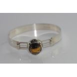 Silver modernist bracelet with tiger's eye