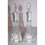Pair of sterling silver rimmed perfume bottles