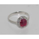 Good oval ruby & diamond cluster ring