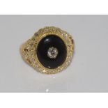 18ct gold, onyx & diamond ring