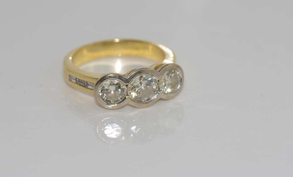 18ct yellow gold and three diamond gold ring