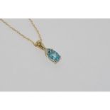 14ct yellow gold blue topaz pendant & 14ct chain