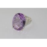 Silver and large oval amethyst ring