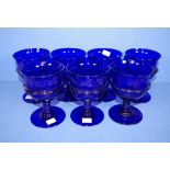 Seven etched cobalt blue goblets