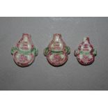 Three antique Cambodian ceramic money tokens