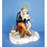 Capodimonte seated man & dog figure