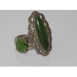 Two silver and green stone rings