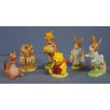 Four Bunnykins and two Winnie the pooh figurines