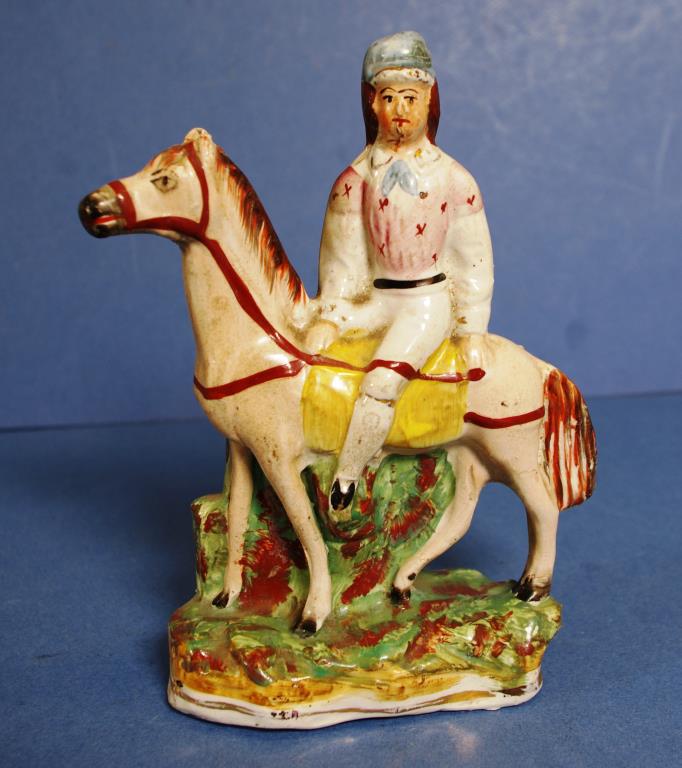 Antique Staffordshire figure of man on horseback