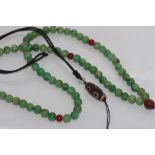 Green beads with a Zi pendant