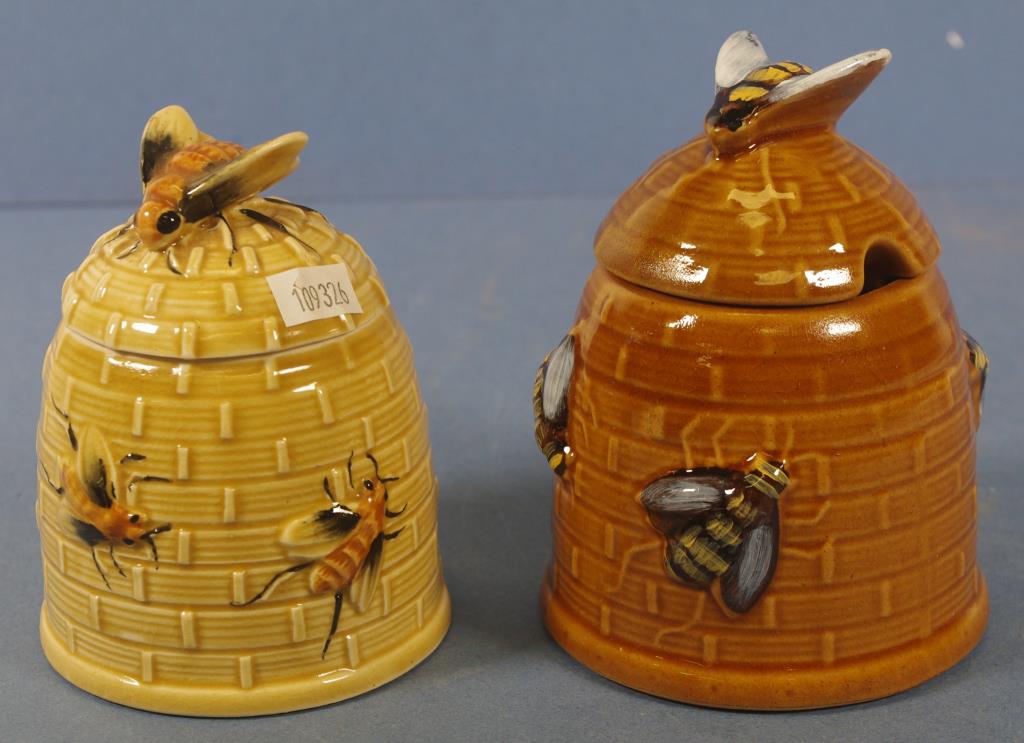 Two similar beehive form ceramic honey pots