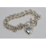 Heavy silver bracelet with heart lock