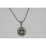 White gold diamond necklace with pearl pendant