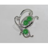 Butterfly brooch with green stones