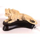 Vintage carved ivory lion figurine