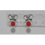 Silver and coral dangling earrings