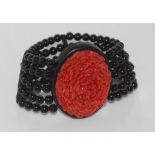 Large ebony, onyx and coral stretch bracelet