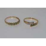 Two yellow gold rings set with emeralds