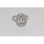 18ct white gold and diamond ring with double C