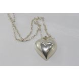 Silver heart shaped pendant on silver chain