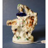 Antique Staffordshire woman with goat figure