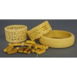 Four various carved ivory bracelets/bangles