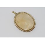 Antique 15ct yellow gold oval open locket pendant