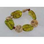Green amber bracelet with garnets