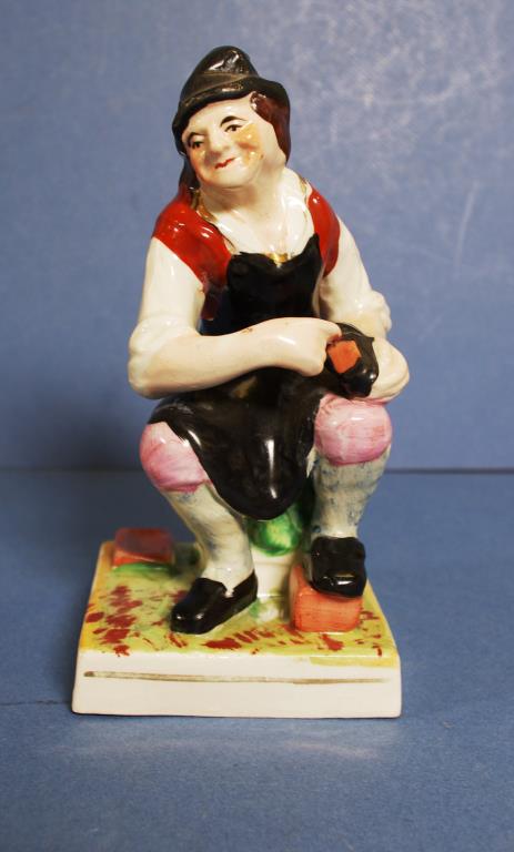 Antique seated cobbler man figure