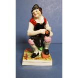 Antique seated cobbler man figure