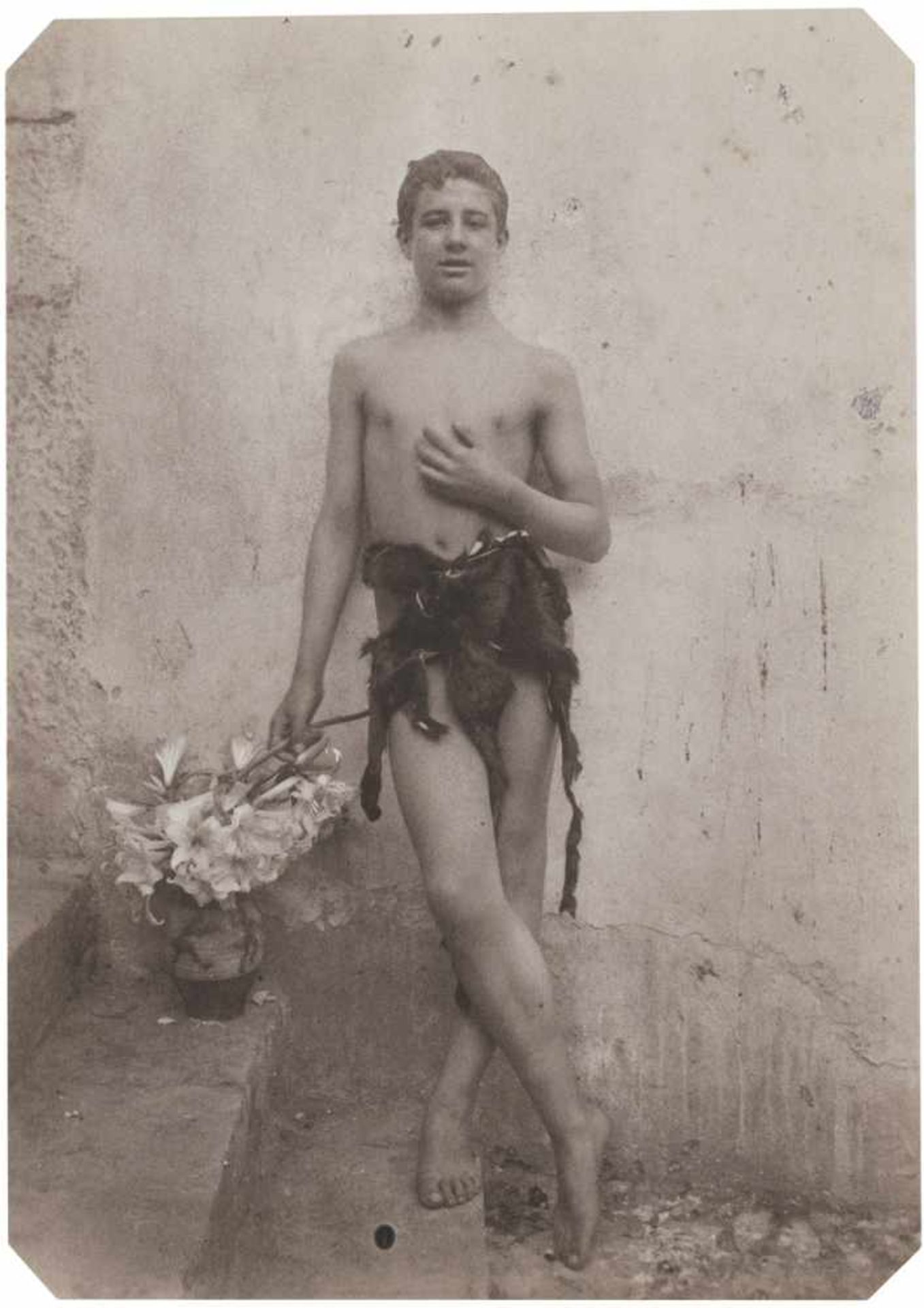 Gloeden, Wilhelm von: Young boy with fur loincloth Young boy with fur loincloth. Circa 1900. Matte